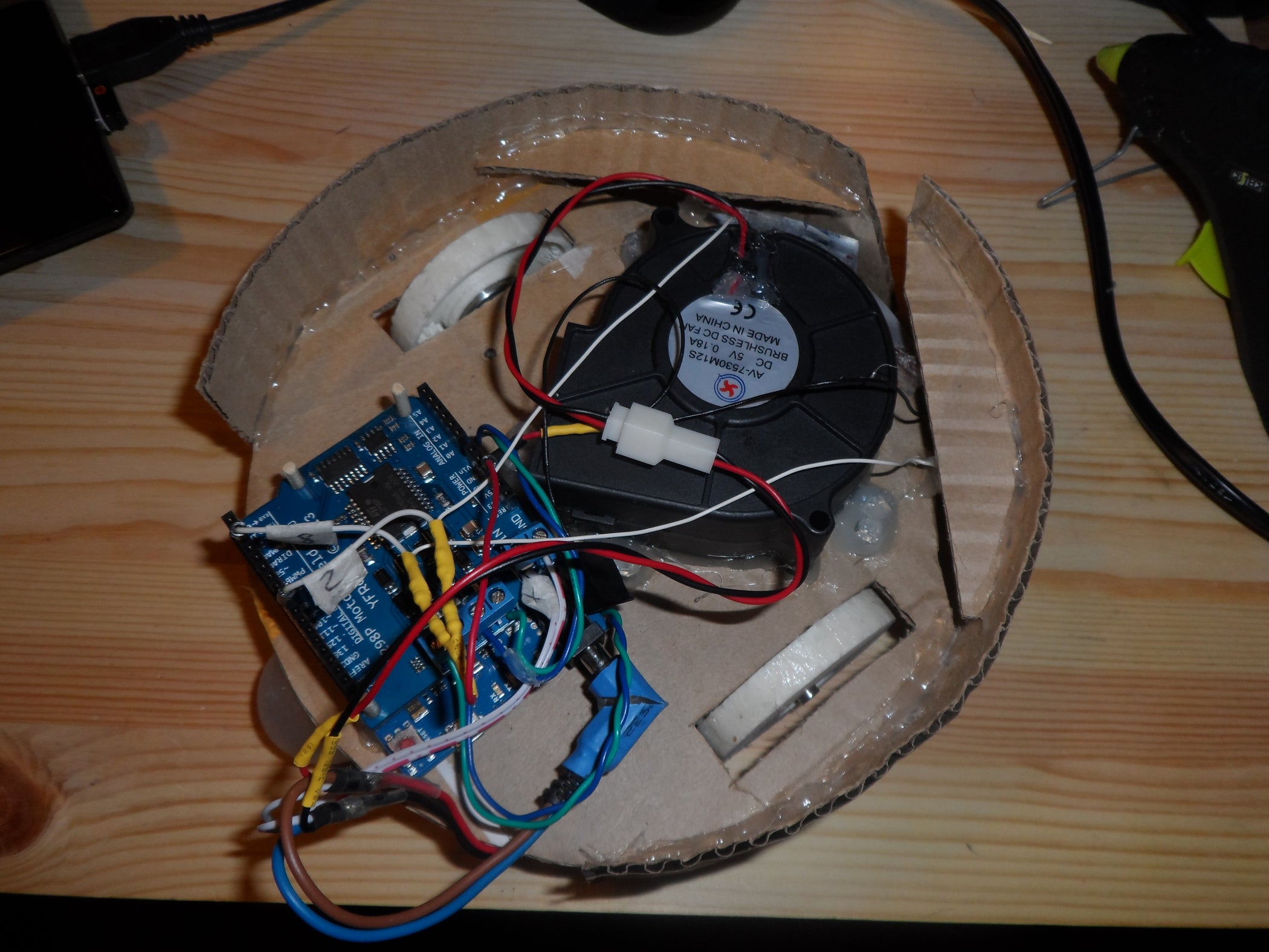 Floor Vacuum Cleaner Robot Controlled by Arduino With Motor Shield
